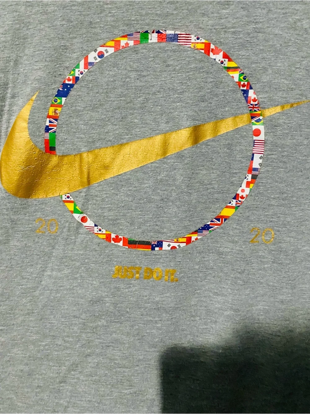 Nike Gray Short-Sleeve Tee with Gold Swoosh and Multicolor Flag Ring